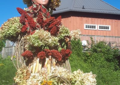 Corn queen in front of Crazy 8 Barn & Garden