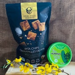 A bag of Cedar Valley Pita Chips and Summer Fresh Hummus