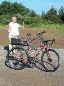 Susanne Spence Wilkins with her two bikes ready for taking on new adventures